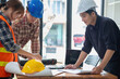 © PHAISITSAWAN - Concept meeting engineers or architects for projects working with partners and engineering tools to create models and blueprints at the job site. construction concept. Engineer concept.