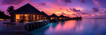 Overwater Bungalows At Luxurious Tropical Resort At Sunset With Purple And Peach Color Sky