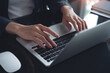 © tippapatt - Closeup of business woman hands working and typing on laptop computer keyboard, surfing the internet, searching the information, global internet network, telework, email marketing