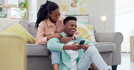 Canvas Print - Home, relax and black couple with a smartphone, funny or connection with network, social media or mobile user. African people, man or woman in a lounge, cellphone or digital app with meme or laughing