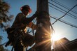 Electrician climbing a utility pole