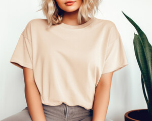 Soft Cream Shirt Mockup, Oversized Blank T-Shirt Template, Fashion, Female, Girl, Women, Model, Wearing a Soft Cream Tee Shirt, Jeans, Standing In A Room With The Plant.