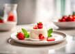 Italian dessert panna cotta with strawberries, mint leaves on a wooden plate