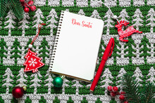 Dear Santa. Letter To Santa Claus On A Christmas Crochet Background With Wooden Toys. Flat Lay. Copy Space.