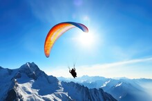 Paraglider In Blue Mountain Landscape In Cold Winter