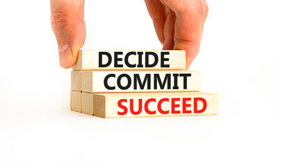 Wall Mural - Decide commit succeed symbol. Concept word Decide Commit Succeed on beautiful wooden block. Businessman hand. Beautiful white table background. Business decide commit succeed concept. Copy space.