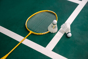 Competitive sports idea with badminton rackets and shuttlecock