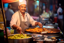 Flavors Of India: A Portrait Of A Man Thriving As A Street Food Vendor In India, Surrounded By The Bustling Energy Of A Vibrant Market And His Food Cart.

