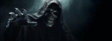 Grim Reaper Reaching Towards The Camera Isolated On Smoky Scary Dark Background With Copy Space, Halloween Poster Idea.
