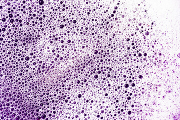 Wall Mural - Water foam texture. White foam structure. Purple bubble background. Washing suds pattern. Chemical detergent backdrop. Violet foam. Suds background.