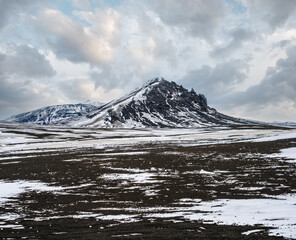 Canvas Print - Colorful Landmannalaugar mountains under snow cover in autumn, Iceland. Lava fields of volcanic sand in the foreground.