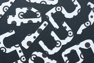 Poster - large abstract looking numbers (123) machine-cut from black and white paper with spots, rings, or dots on blank paper