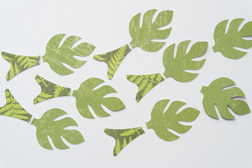 Canvas Print - palmette-like leaves or trees machine-cut from decorative scrapbooking paper and arranged on blank paper