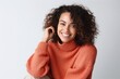 © Anne Schaum - Medium shot portrait photography of a Peruvian woman in her 30s wearing a cozy sweater against a white background