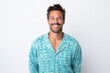 Portrait photography of a Peruvian man in his 30s wearing a snuggly pajama set against a white background