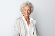 © Anne Schaum - Medium shot portrait photography of a French woman in her 90s against a white background