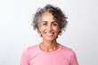 © Anne Schaum - Portrait photography of a Colombian woman in her 50s wearing a sporty polo shirt against a white background