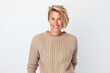 © Anne Schaum - Portrait photography of a Swedish woman in her 30s wearing a cozy sweater against a white background