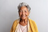 Fototapeta Do akwarium - Medium shot portrait photography of a 100-year-old elderly Colombian woman against a minimalist or empty room background