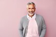 © Anne Schaum - Lifestyle portrait photography of a Italian man in his 50s against a pastel or soft colors background