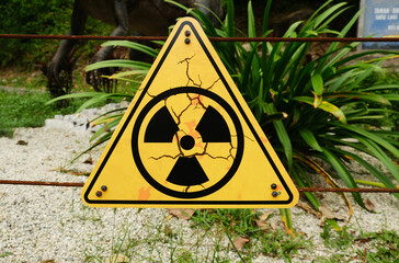 Selective focus picture of radioactive sign at gate.