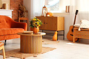 Canvas Print - Interior of living room with pumpkins, sofa and table