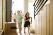 © AntonioDiaz - Excited kids moving in and laughing while running in their new home