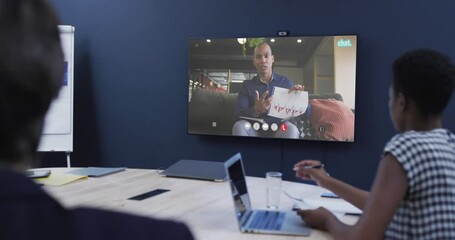 Poster - Diverse business people on video call with african american male colleague on screen