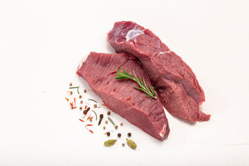 raw beef steak with rosemary isolated on white background, copy space  2