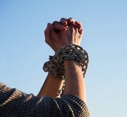 Wall Mural - Women's hands in iron chains