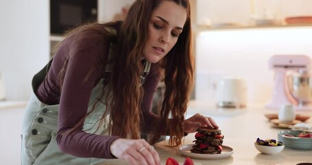 Sticker - Cooking, breakfast and woman in a kitchen with pancakes, fruit or healthy snack in her home. Food, brunch and female with waffle, stack and strawberry for health, nutrition or diet, sweet or meal