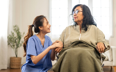 Portrait of smiling caring asian nurse service help support discussing and consulting taking care, caring, caregiver with senior elderly asian woman at home visit.senior retirement home care concept