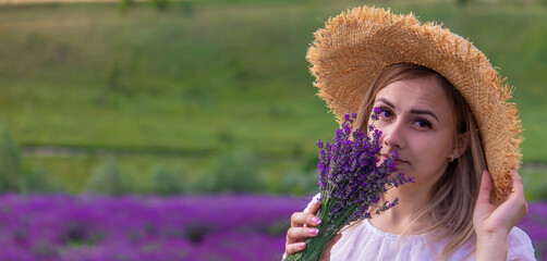 Wall Mural - girl in lavender field. Selective focus.