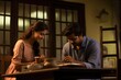 © Justlight - In softly lit room within rustic chai house, young, ambitious South Asian woman uses trained acumen in psychology to validate feelings of senior man from Parsi community. By affirming emotions,