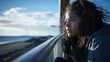 teenage Australian aboriginal girl leans on railing by harbour, drifting off into azure expanse. She tightly clutches acceptance letter from foreign university, torn between excitement and