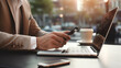 © TStudious - Businessman hand working digital marketing media in mobile phone and laptop computer, m-banking, business finance, Digital online marketing commerce. Generative AI