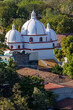 Sunset light giving tridimensional aspect to a church thas has three domes, the second oldest in Latin America