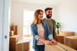 © Andrii  - Smiling Couple Steps into Their New Home