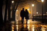 Fototapeta  - Silhouette of a loving couple walking through the city streets on a rainy autumn evening, romantic image inspired by love