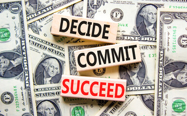 Wall Mural - Decide commit succeed symbol. Concept word Decide Commit Succeed on beautiful wooden block. Dollar bills. Beautiful dollar bills background. Business decide commit succeed concept. Copy space.