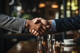 Fototapeta Miasto - Businessmen, business partners shake hands with each other