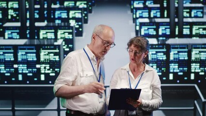 Poster - cloud computing business executives looking around data center, using clipboard to crosscheck disast