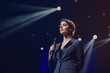 © Lazartivan - Confident Businesswoman in Suit Giving Motivational Speech on Stage