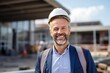 © Baba Images - Smiling portrait of a happy male norvegian developer or architect working on a construction site