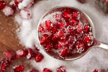 Wall Mural - Pomegranate seeds mixed with sugar