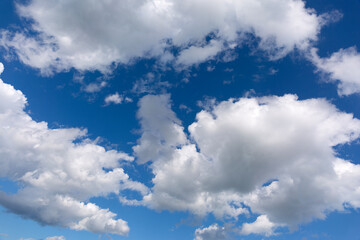 Wall Mural - White clouds on blue sky background.