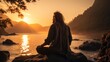 © senadesign - Calm sunset by the sea with a man sitting on a rock and meditating