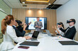 © kelvn - Businesspeople wearing goggles while working with hands reaching out to touch something in virtual world, Brainstorming discussed about work in conference room in the creative office.
