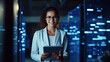 © tong2530 - Data Center Female e-Business Entrepreneur Use Tablet Computer with Pleasure Smile in Big Cloud Computing Server Farm. Generative Ai