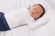 © New Africa - Cute newborn baby sleeping on white bed